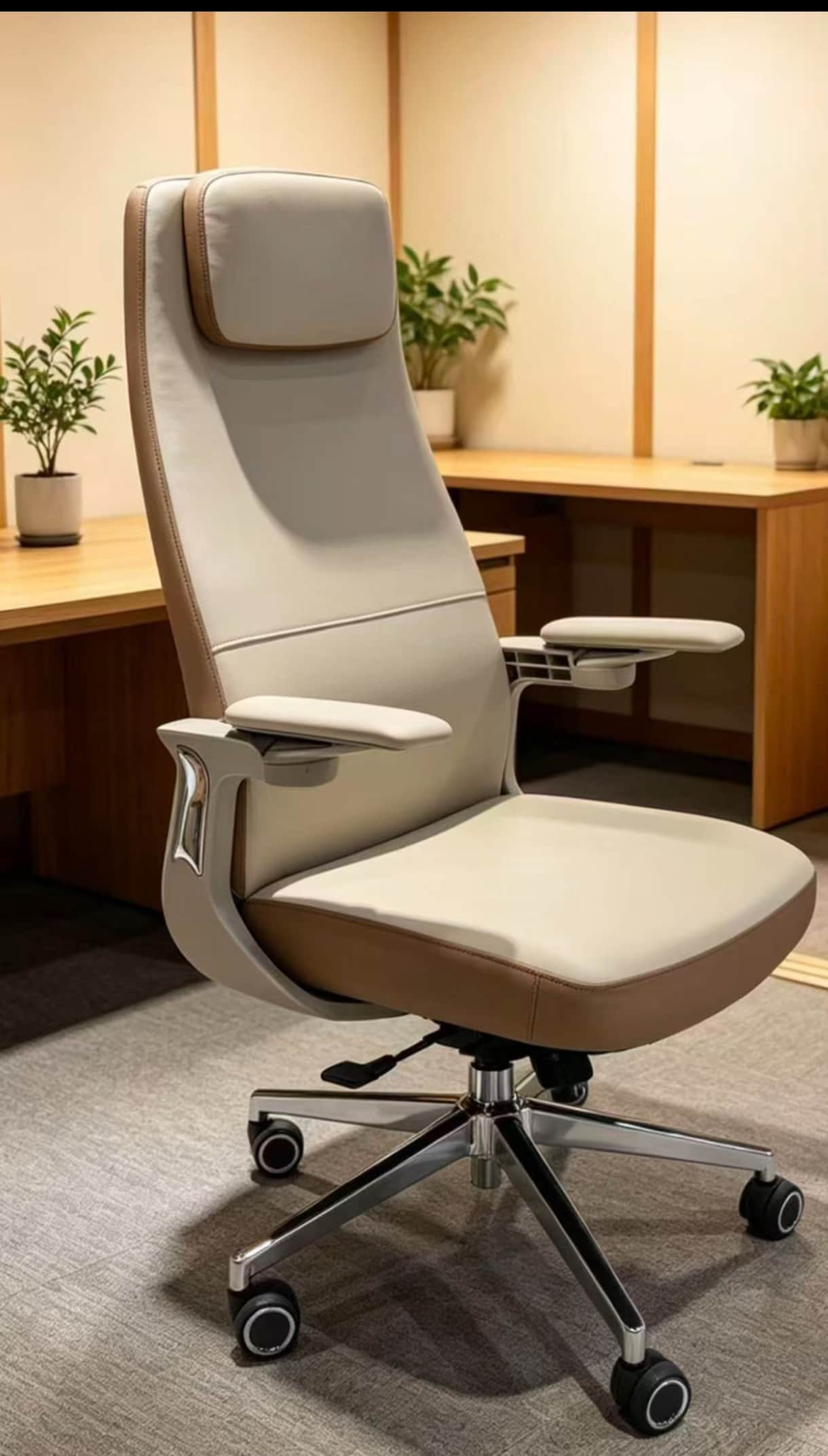 A modern executive office chair upholstered in a two-tone scheme of cream and brown. It features a h… — 3D model