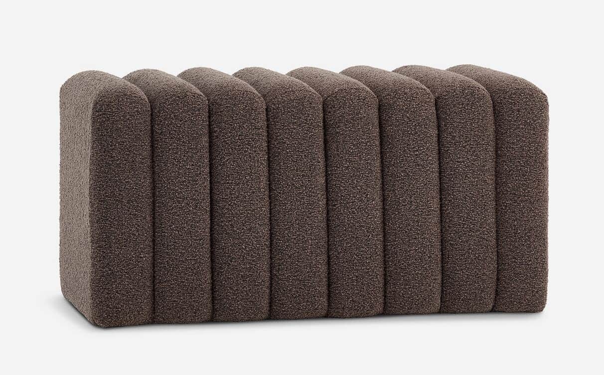 A rectangular ottoman upholstered in a textured brown fabric. It features a series of vertical, roun… — 3D model