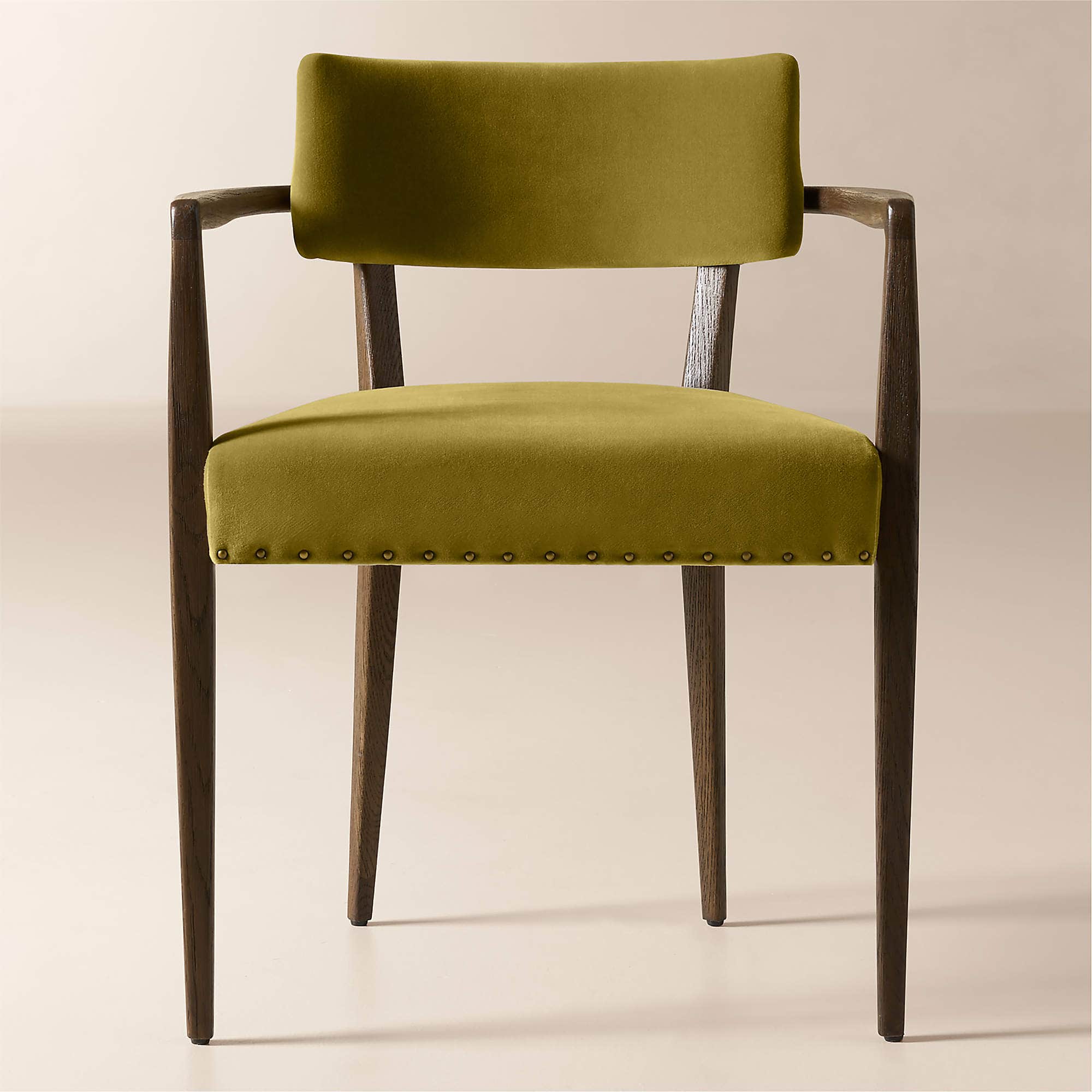 A wooden armchair with upholstered seat and backrest. The frame is constructed from dark stained woo… — 3D model