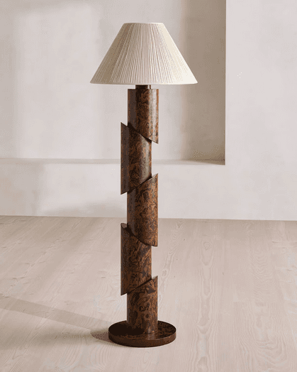 A modernist floor lamp featuring a segmented, cylindrical column base with a burl wood-like pattern,… — 3D model