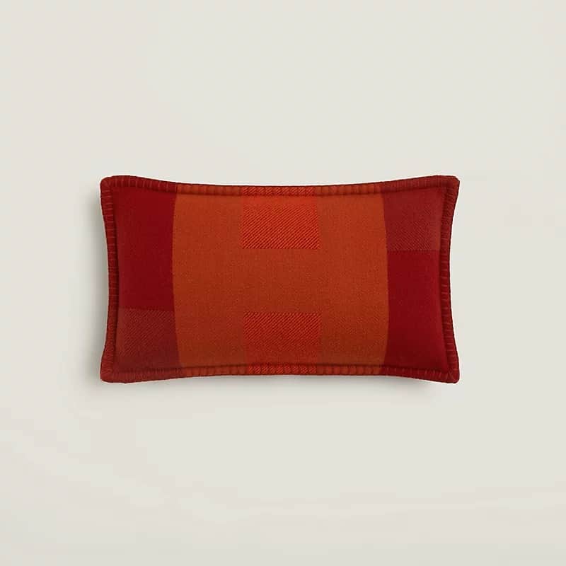 A rectangular decorative pillow featuring a woven wool construction with a prominent plaid pattern i… — 3D model
