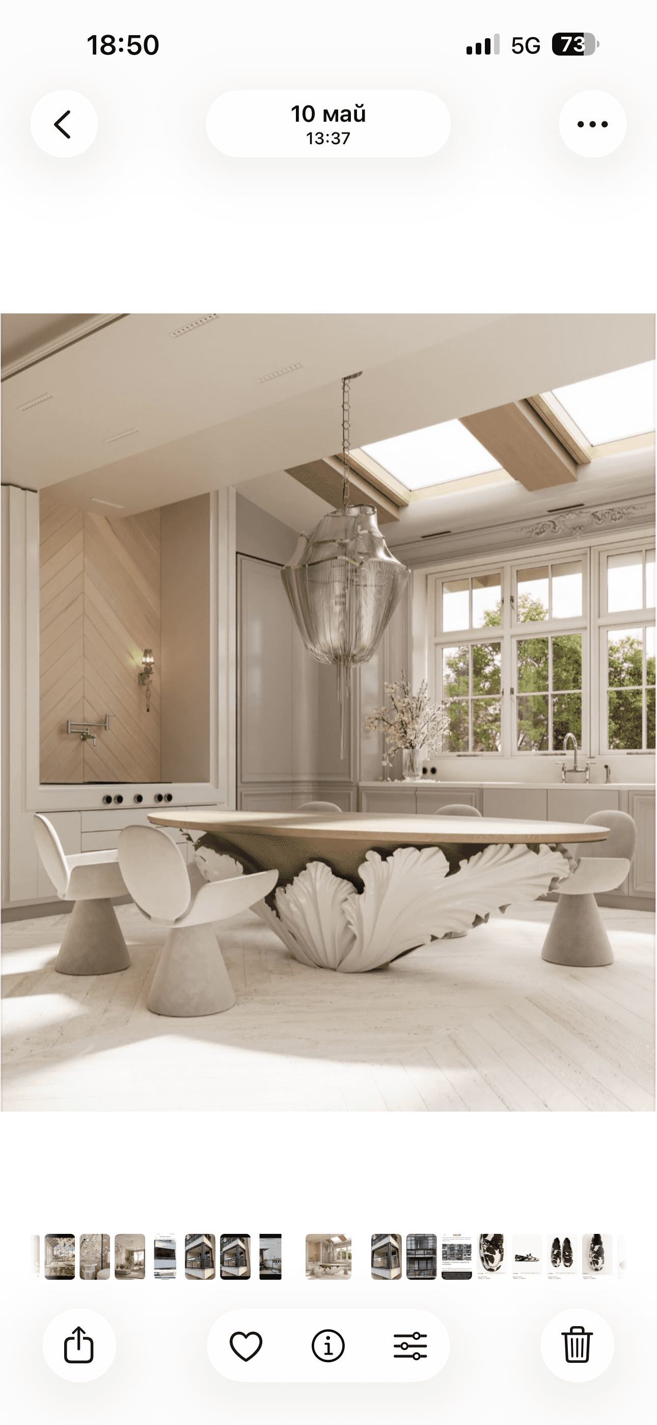 An oval-shaped coffee table featuring a light-toned wood tabletop and a distinctive, sculptural whit… — 3D model