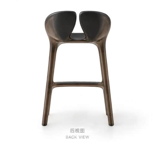A contemporary bar stool featuring a sculptural form, made from a dark, potentially translucent, mol… — 3D model