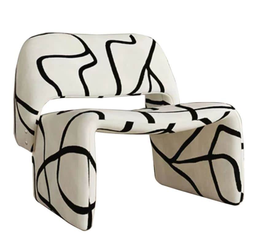 An armchair with a distinctive, sculptural form. The chair features a unified, molded structure that… — free OBJ 3D model