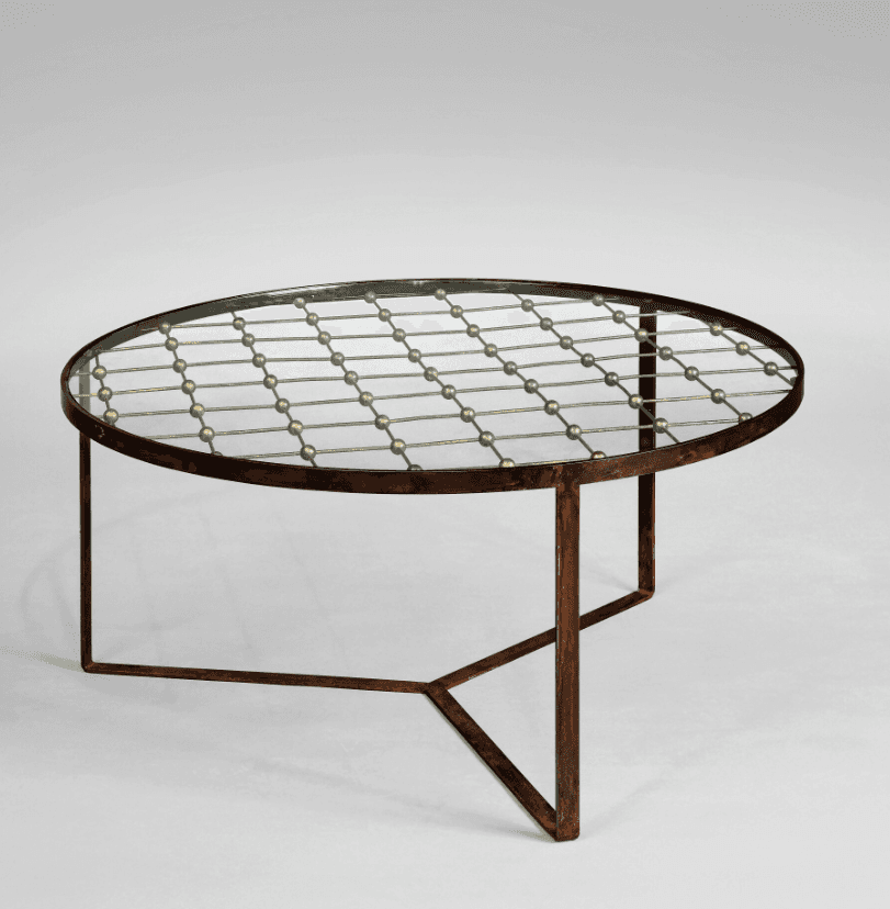 An oval coffee table with a glass top supported by a metal frame. The metal frame features a decorat… — free BLEND 3D model