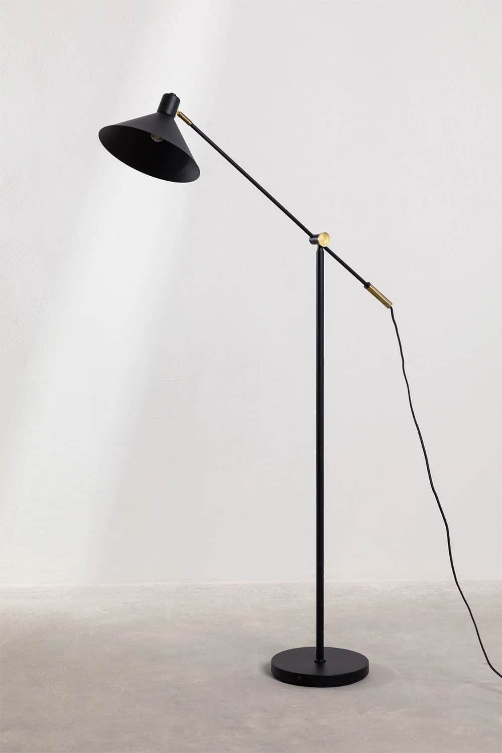 A sleek, modern floor lamp featuring a matte black finish and brass accents. It has an articulated a… — 3D model