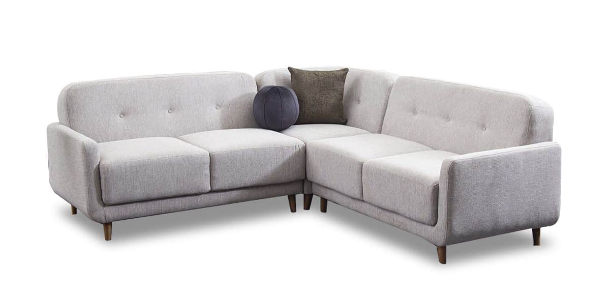 A light gray sectional sofa with clean lines and rounded edges. It features tufted back cushions and… — 3D model