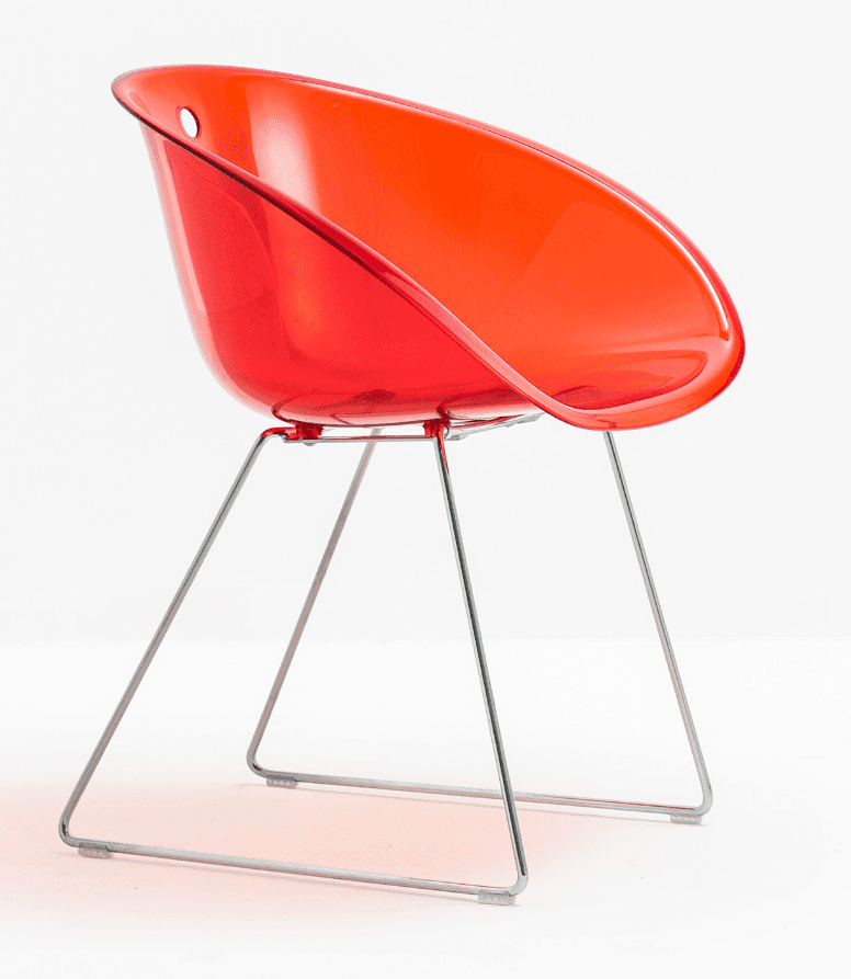 A contemporary chair featuring a single-piece, translucent red plastic shell for the seat and back,… — 3D model