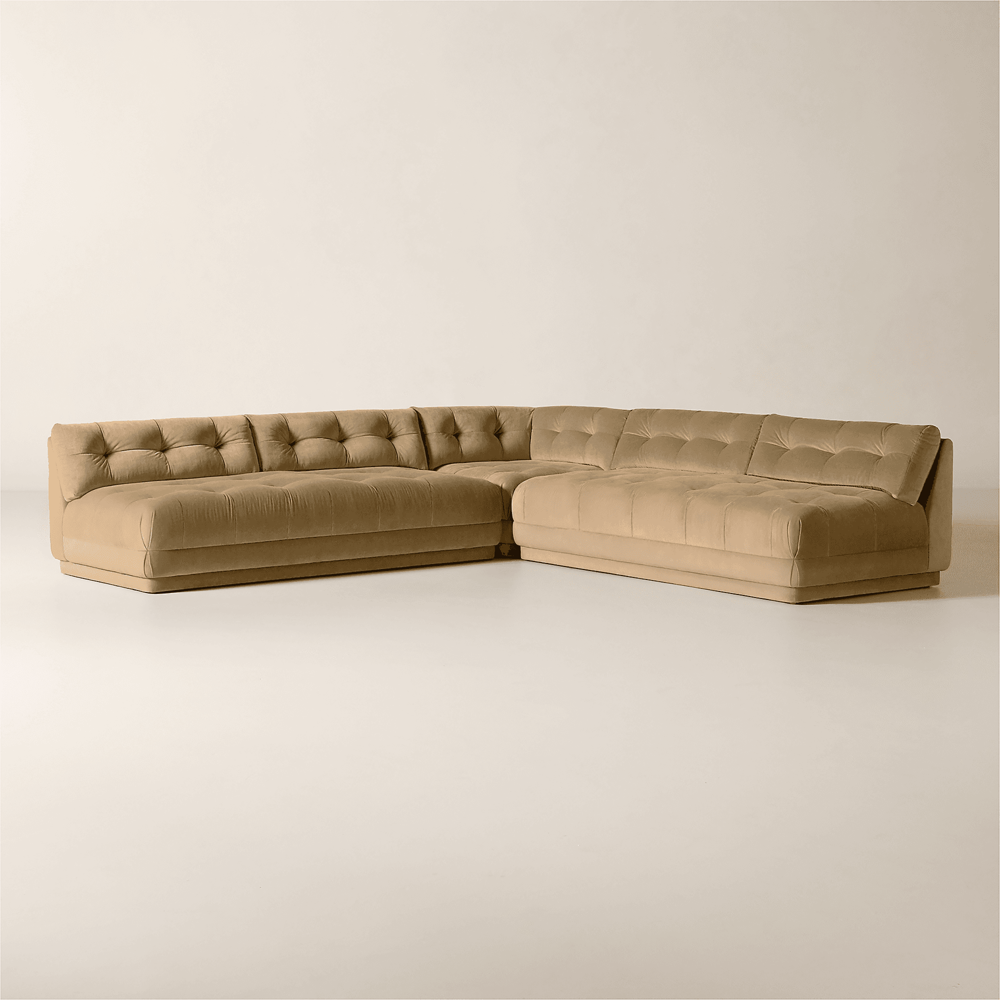 A tufted sectional sofa with a low profile and blocky silhouette. The sofa features a plush, velvet-… — 3D model