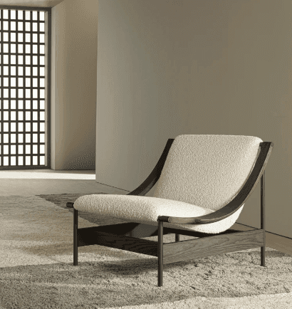 A modern lounge chair featuring a dark-stained solid wood frame and plush, off-white bouclé fabric u… — 3D model