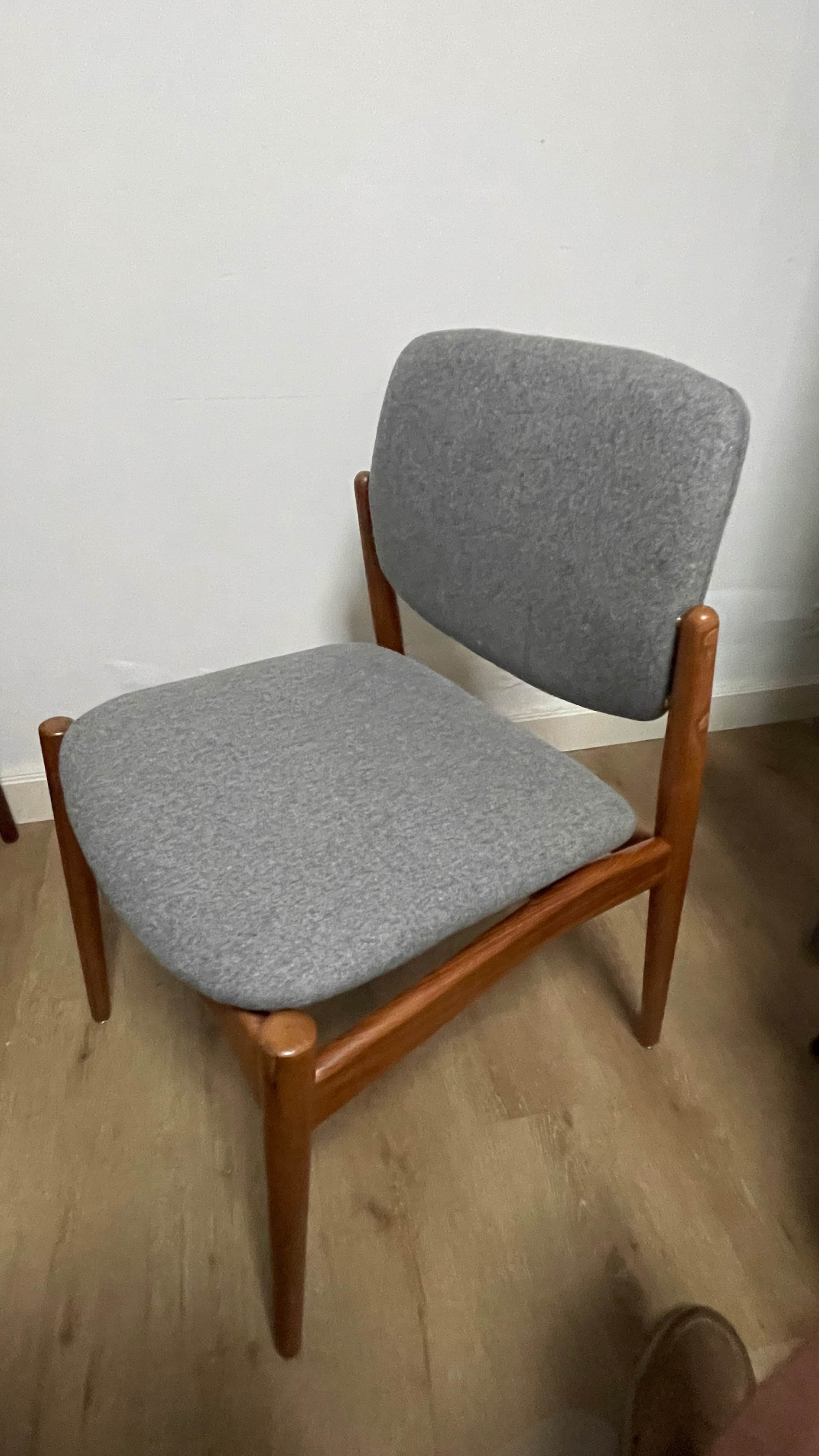 An armless dining chair with a visible solid wood frame and upholstered seat and back. The wood has… — free OBJ 3D model