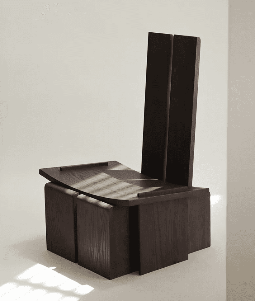 A dark wood chair featuring a highly geometric and architectural design. The backrest is composed of… — 3D model