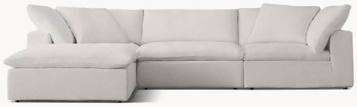 A light grey modular sectional sofa featuring deep seating and a relaxed, plush aesthetic. It compri… — 3D model