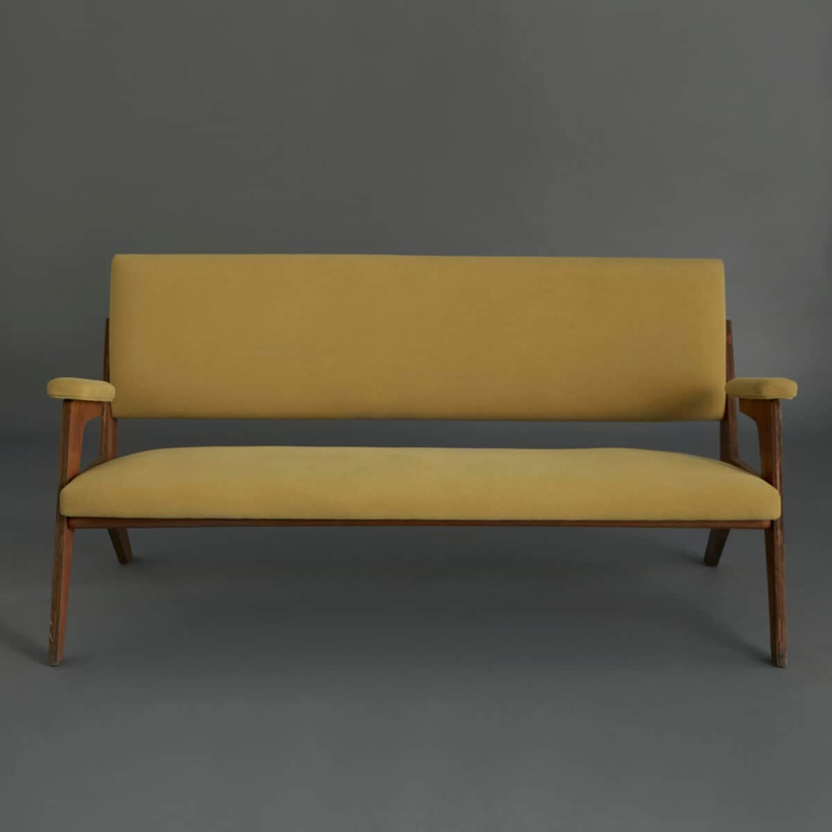 A two-seater sofa with a wooden frame and upholstered cushions. The sofa features a rectangular back… — 3D model