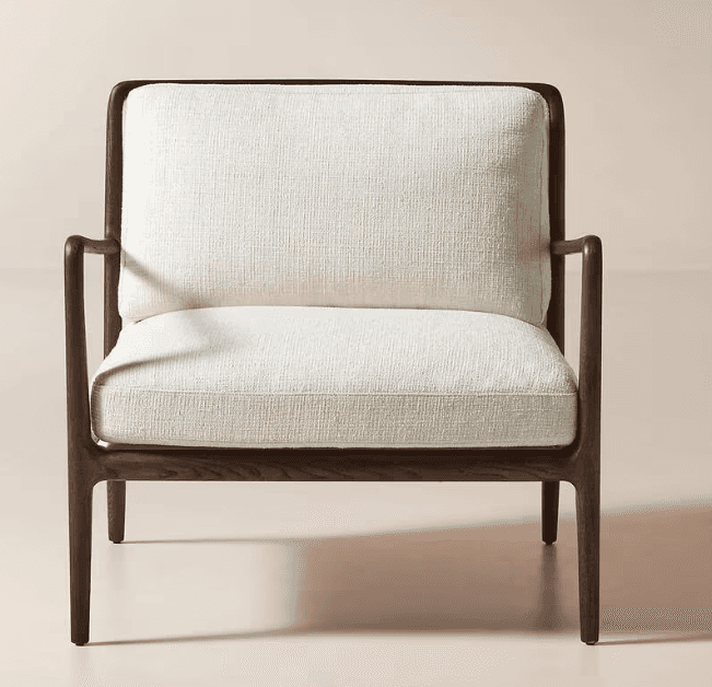 A contemporary armchair featuring a dark wood frame with a warm finish. The frame has a streamlined… — free OBJ 3D model