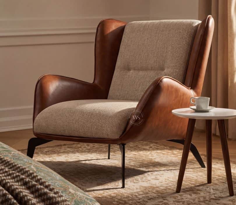 A modern lounge chair featuring a distinctive two-tone upholstery design. The outer shell and armres… — 3D model