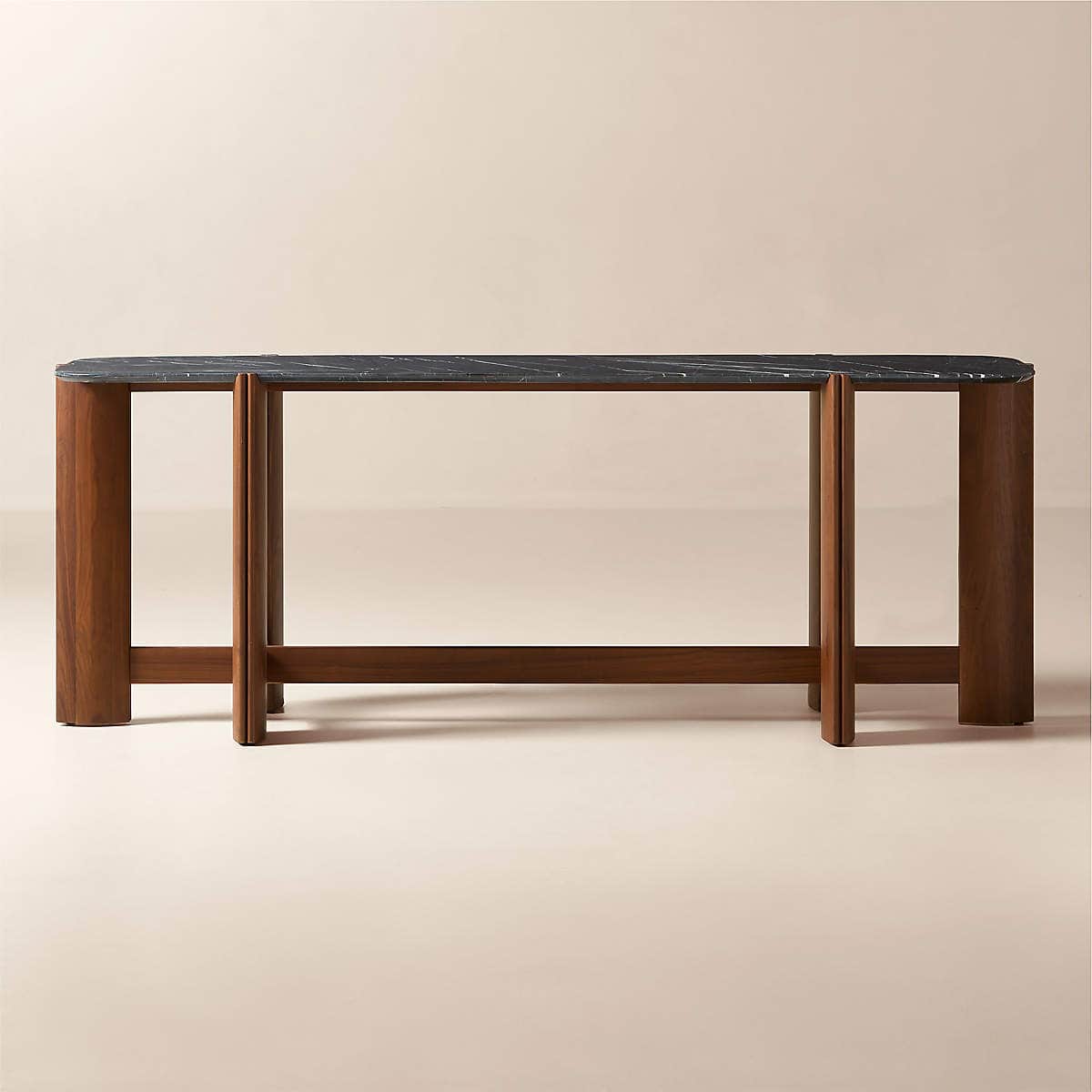 A modern console table featuring a rounded rectangular black marble top and a distinctive walnut woo… — 3D model