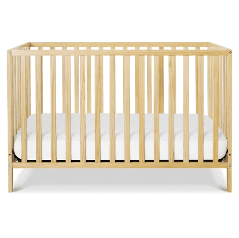A light natural wood baby crib with vertical slatted sides and a white mattress inside, presented on… — 3D model