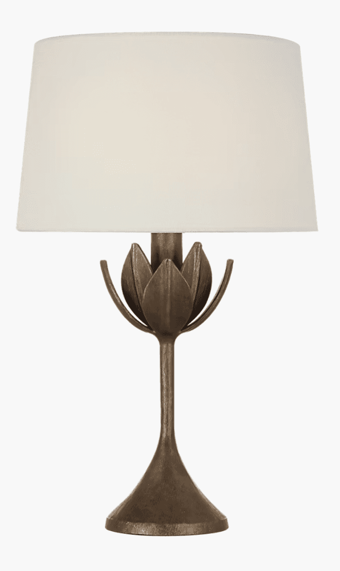 An accent table lamp featuring a bronze-finished metal base with a lotus flower motif and a cylindri… — 3D model