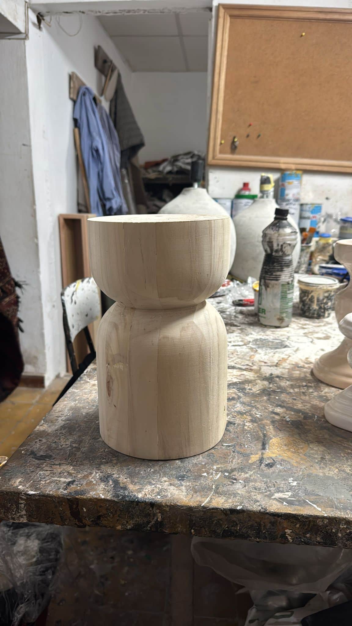 A small, wooden stool with a rounded top section that forms a bowl shape, and a cylindrical base. Th… — free SKP 3D model