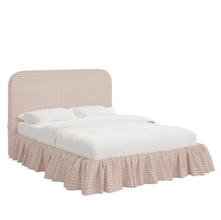 A bed with a upholstered headboard and a ruffled bed skirt. The headboard has a rounded top and is u… — 3D model