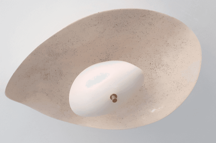 A textured, off-white, leaf-shaped shade with a speckled pattern encases a central, smooth, white, e… — 3D model