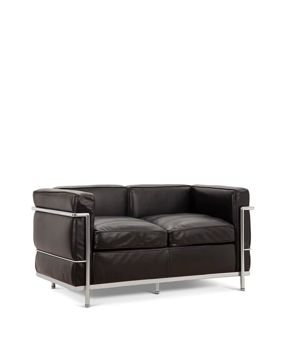 A two-seater sofa with a minimalist design. It features a polished chrome tubular steel frame that e… — 3D model