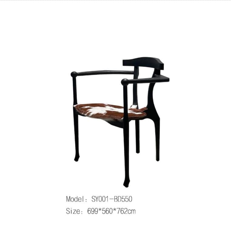 A black armchair with a unique, sculpted frame. The seat is upholstered with what appears to be a co… — 3D model