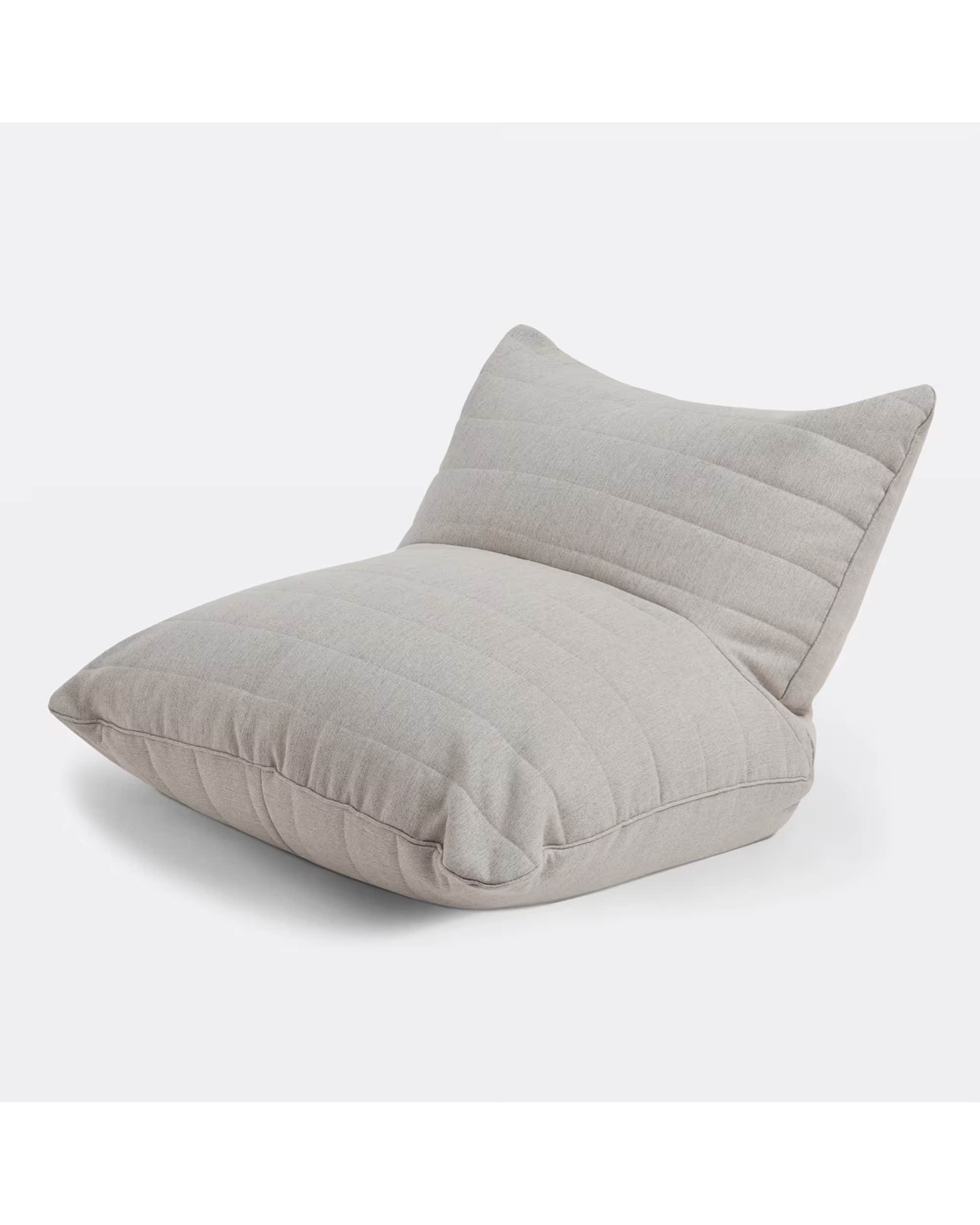 A contemporary bean bag chair with a low profile and an ergonomic design. It features a channel-stit… — 3D model