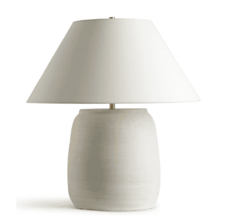 A modern table lamp featuring an off-white, textured ceramic base with a slightly barrel-shaped form… — 3D model