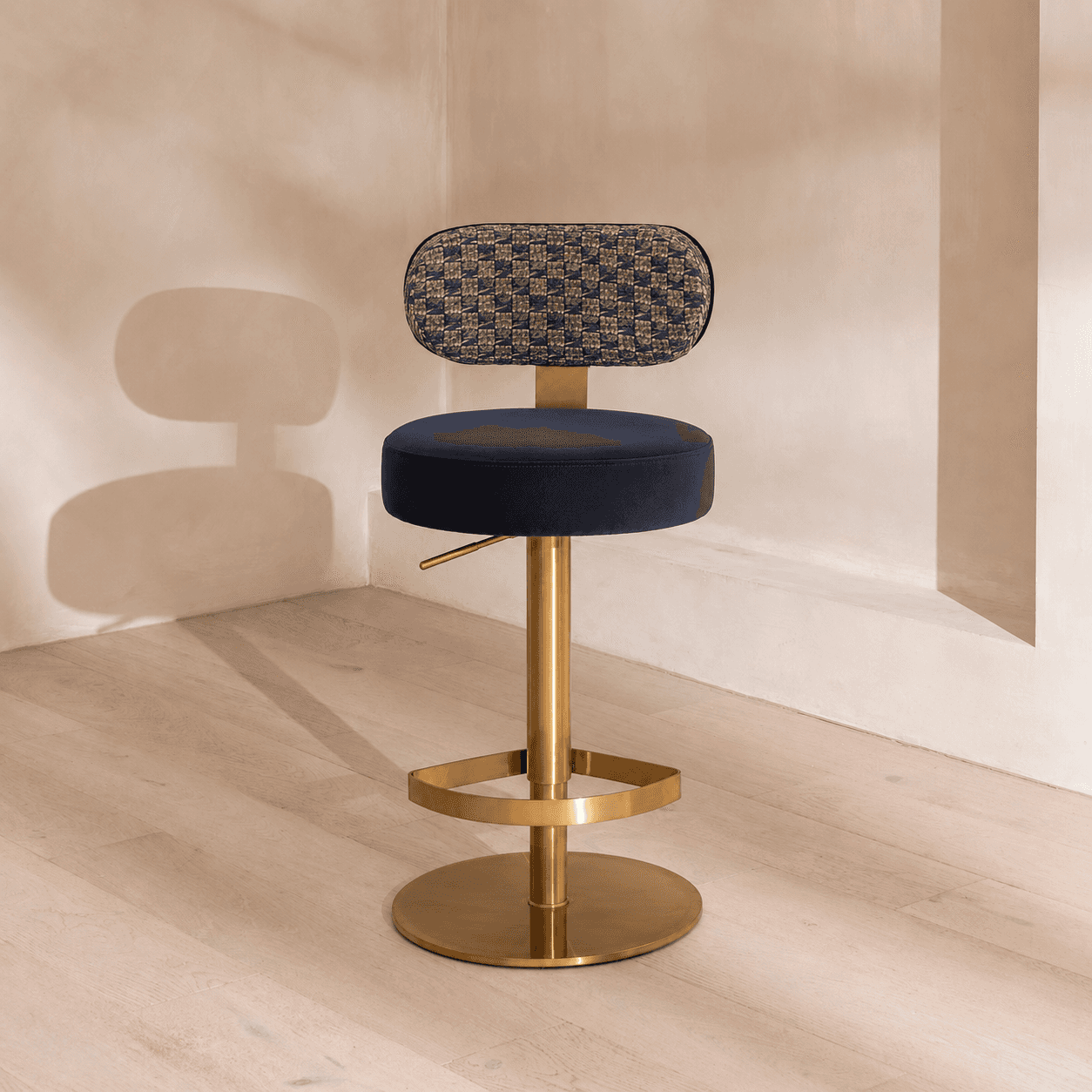 A modern adjustable height bar stool featuring a dark blue velvet upholstered seat and a patterned w… — 3D model