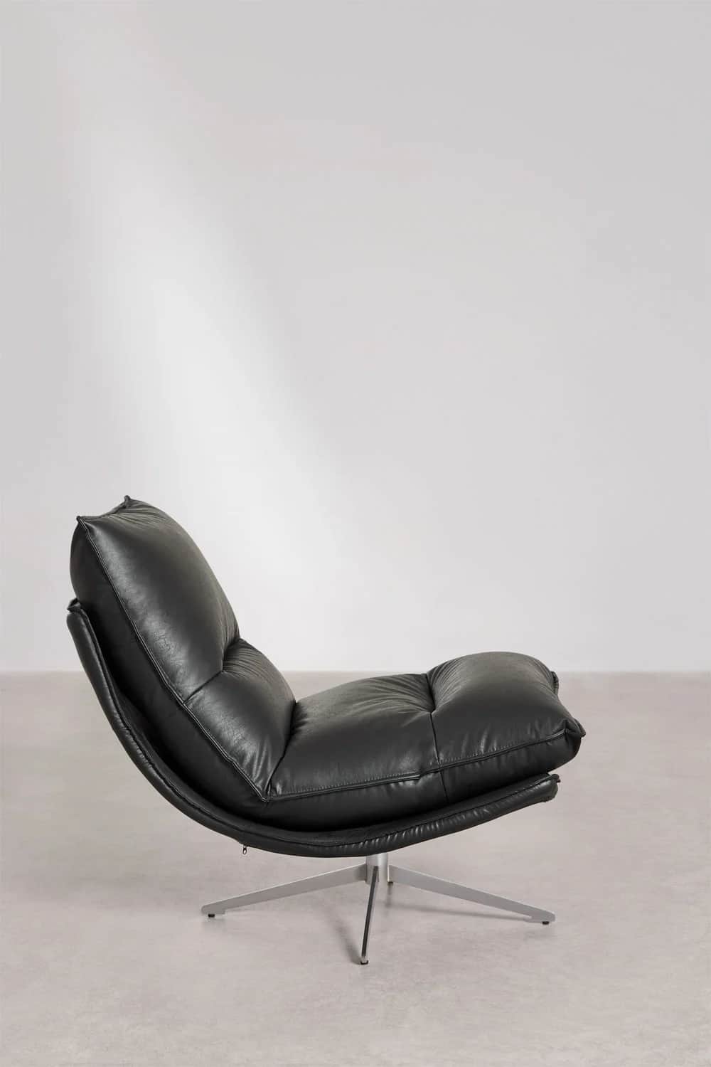 A contemporary black leather lounge chair with a tufted, cushioned seat and back. The chair features… — 3D model