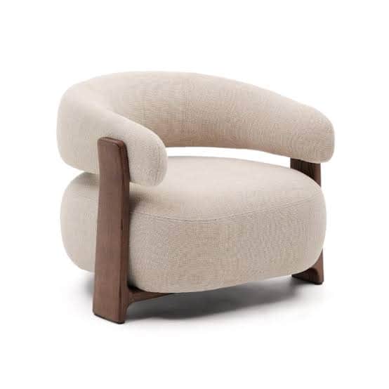 A contemporary lounge chair featuring a rounded, plush upholstered seat and backrest, supported by a… — 3D model