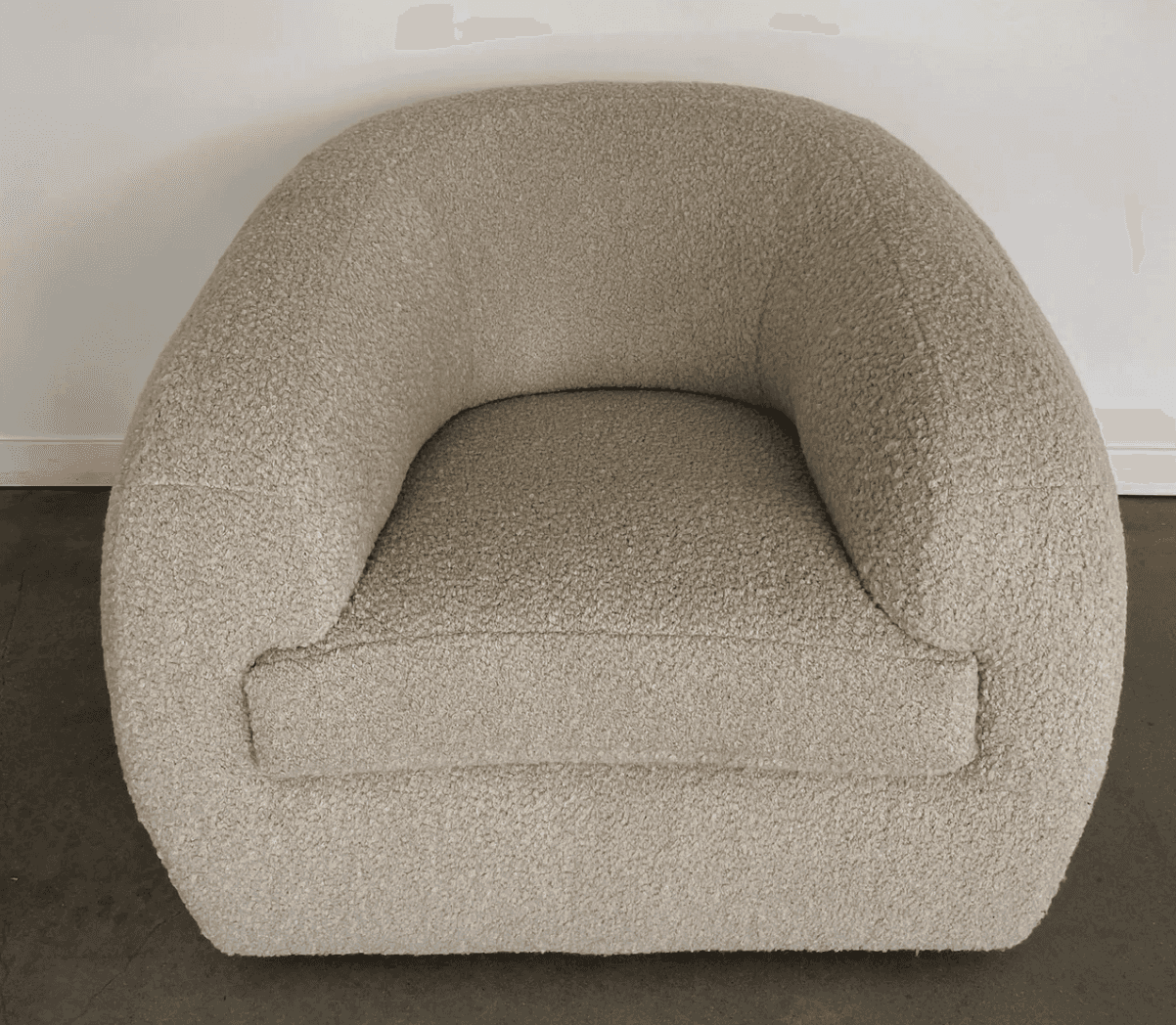 A rounded armchair with a plush, textured upholstery. The armchair features a deep seat and a wrapar… — free OBJ 3D model