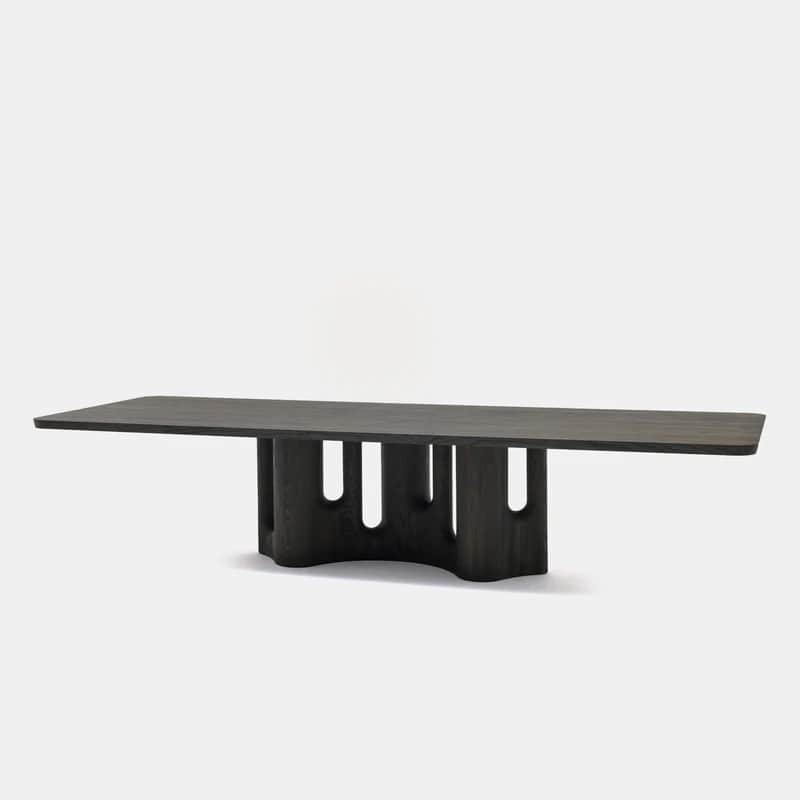 A contemporary dining table featuring a rectangular top with rounded corners, supported by a distinc… — 3D model