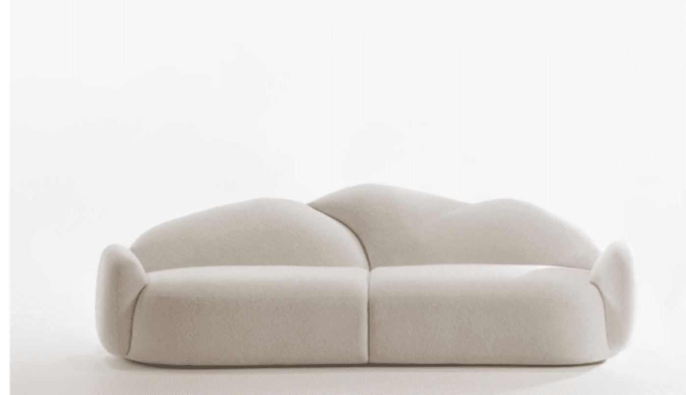 A cream-colored, upholstered sofa with rounded, organic forms. The sofa features a high, undulating… — 3D model