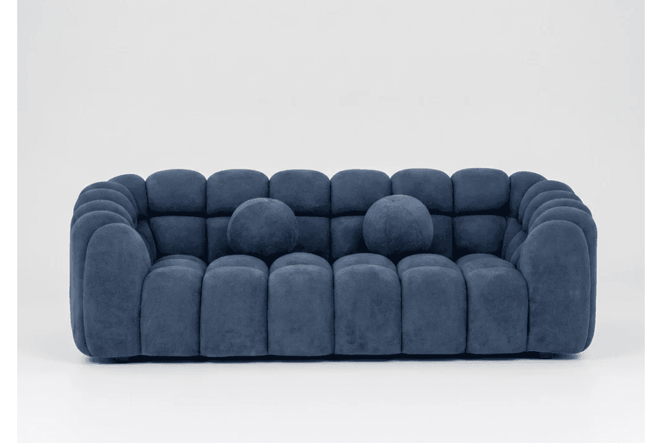 A modern three-seater sofa characterized by its sculptural, rounded, segmented design, upholstered i… — free GLB 3D model