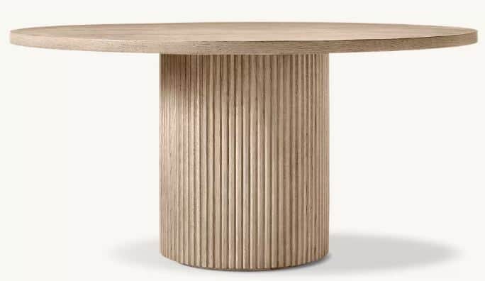 A contemporary round dining table featuring a light wood finish and a distinctive vertically fluted… — 3D model