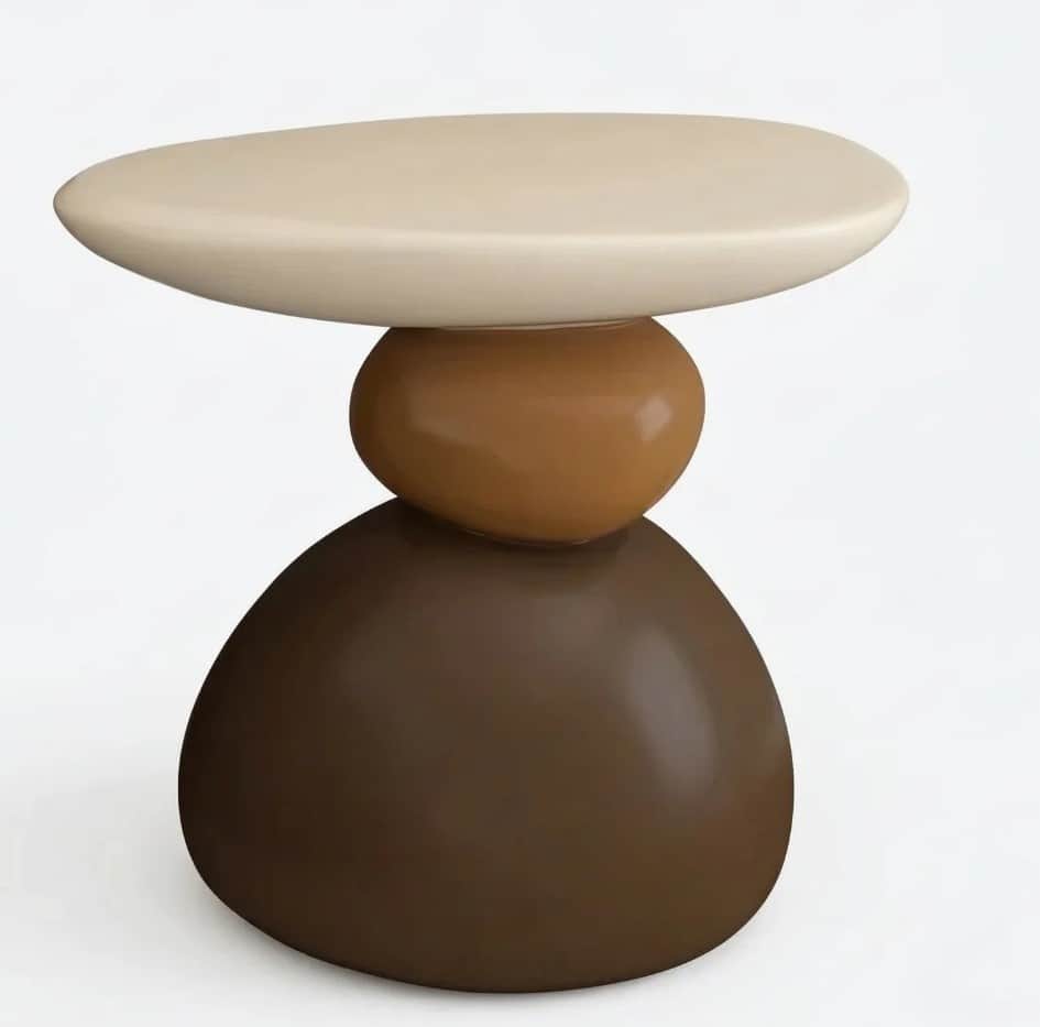 A contemporary side table with a sculptural design, resembling stacked stones. It features an oval-s… — 3D model