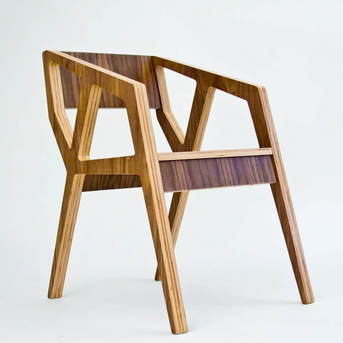 A modern armchair constructed from layered plywood with a rich wood veneer. It features a distinctiv… — free OBJ 3D model