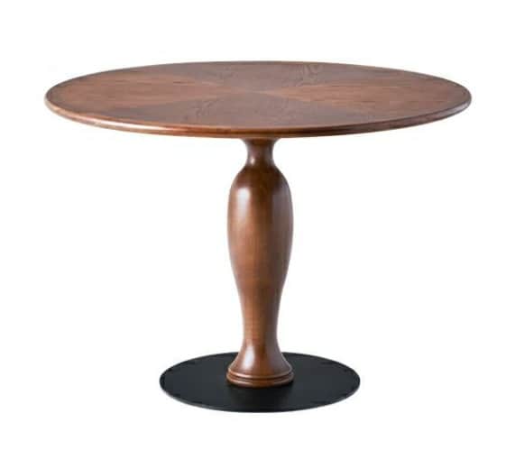 A round wooden table featuring a turned wooden pedestal base and a circular black metal footplate. T… — 3D model