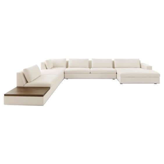 A contemporary, large modular sectional sofa upholstered in a light-colored fabric, featuring a deep… — 3D model