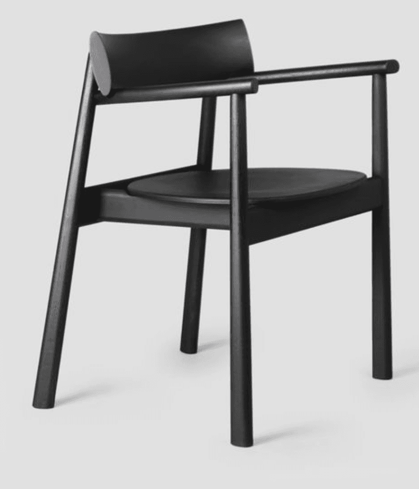 A minimalist armchair with a curved backrest and a circular seat. The armchair features a dark finis… — 3D model