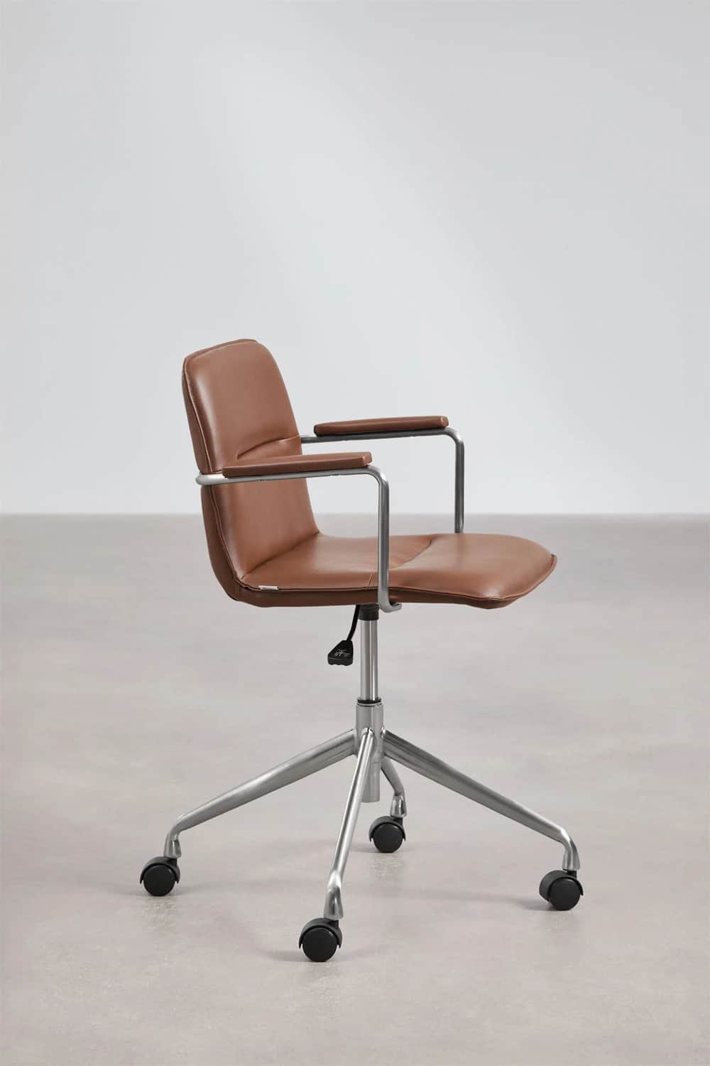 A modern office chair with a low-back design, featuring a brown leather seat and backrest, supported… — 3D model