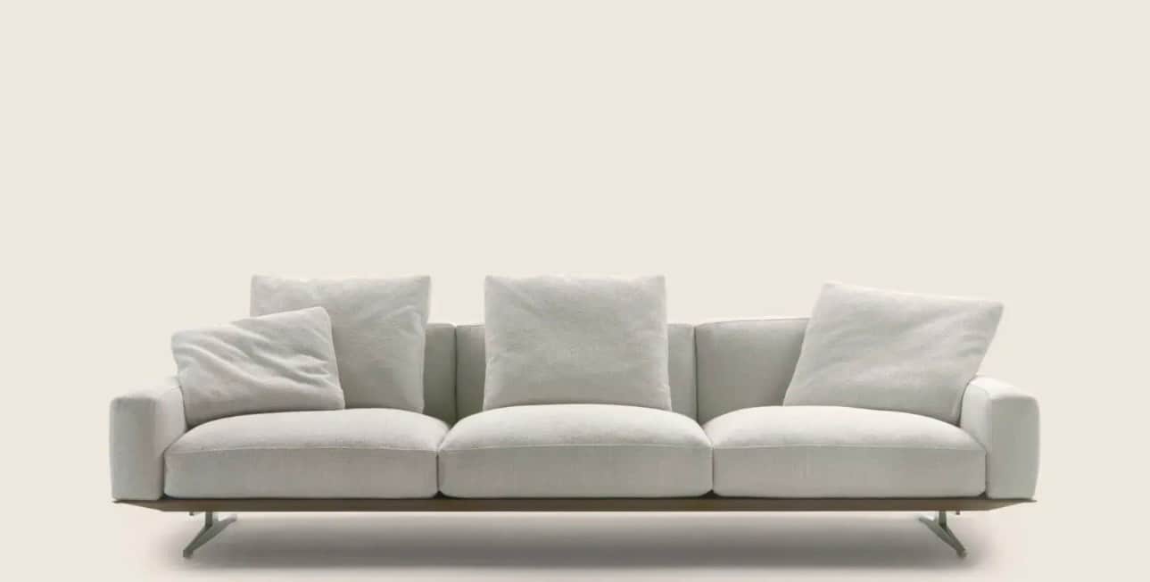 A contemporary three-seater sofa with plush cushions and a low profile. The sofa features a slim fra… — 3D model