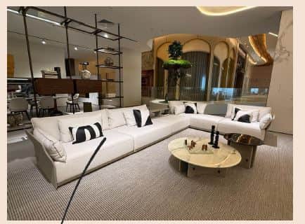An L-shaped sectional sofa featuring a modern, minimalist design. It is upholstered in a light-color… — 3D model