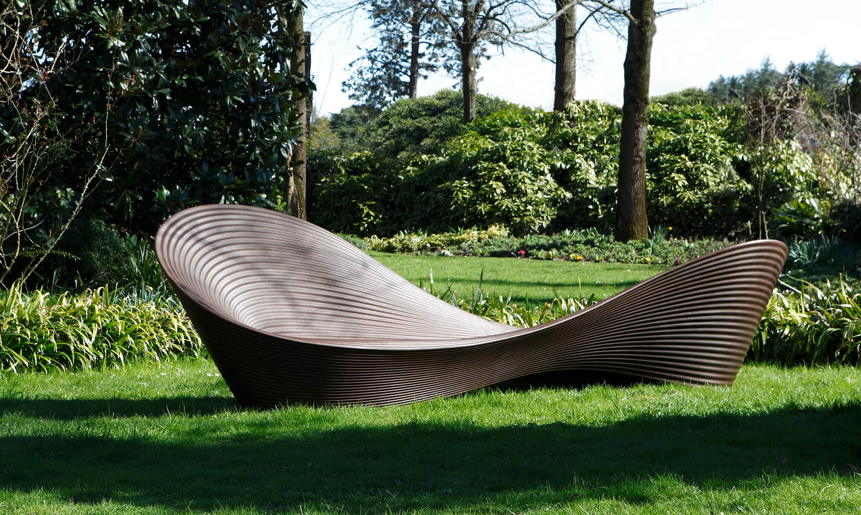 A contemporary, sculptural chaise lounge featuring an undulating, ergonomic form and a distinctive r… — free STL 3D model