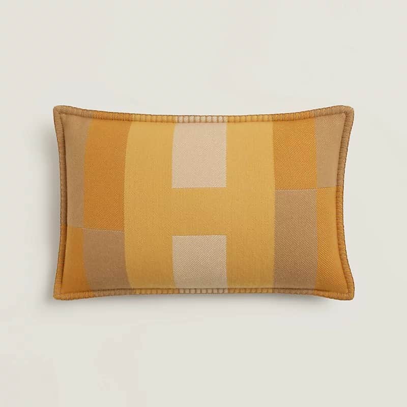A rectangular decorative throw pillow featuring a geometric pattern composed of blocks of color in v… — 3D model