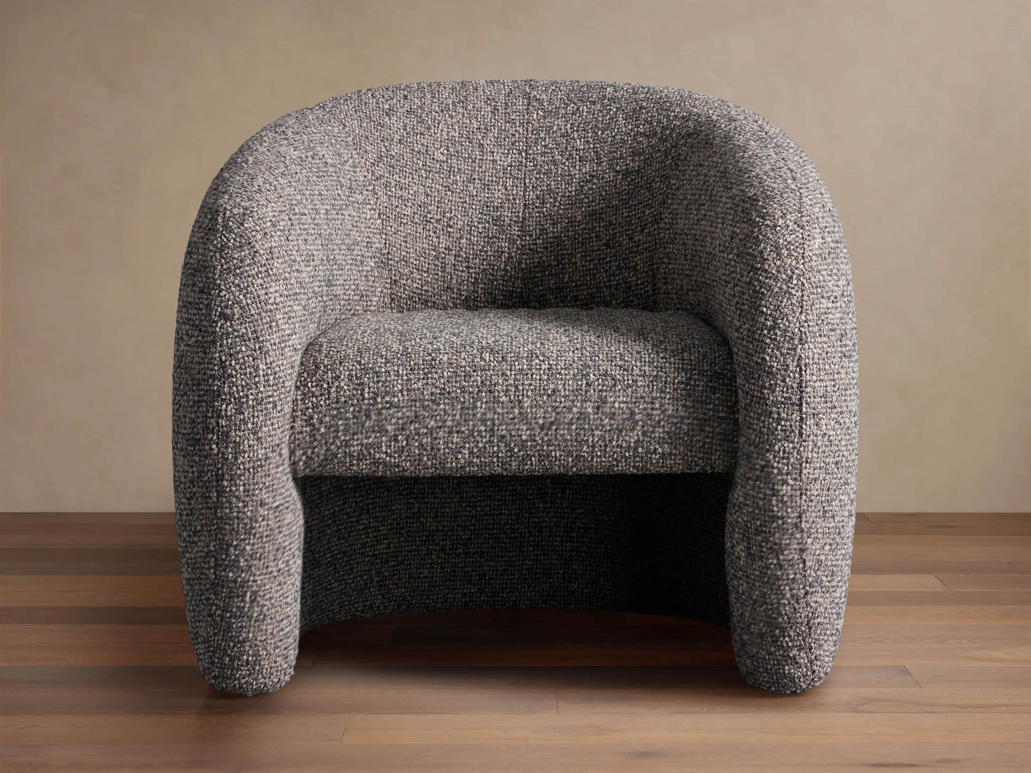 A generously proportioned armchair with a rounded, enveloping silhouette. The chair features a fully… — free OBJ 3D model