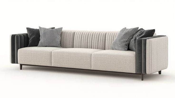 A long, contemporary three-seater sofa featuring channel-tufted armrests and back panels in a dark c… — 3D model